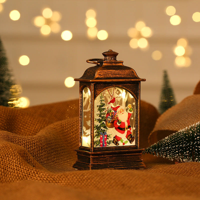 Portable painted Christmas ornaments in a lantern displaying Santa Claus and festive decorations.